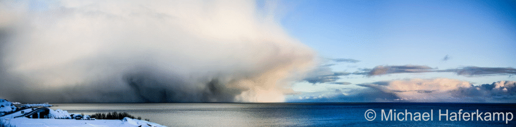 A snow squall approaches over Vestfjorden